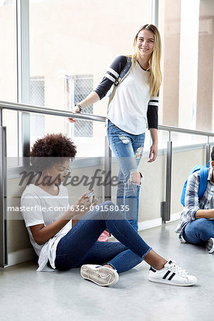 Students hanging out in school corridor