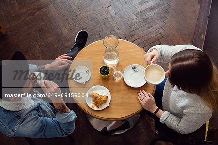 Couple having coffee in cafe