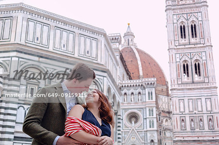 Young couple hugging, Santa Maria del Fiore, Florence, Toscana, Italy