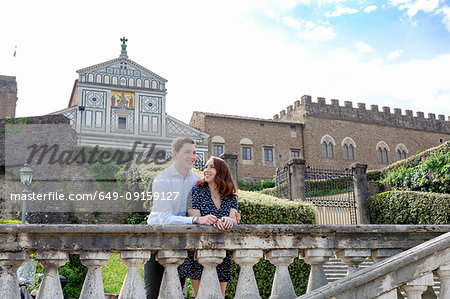 Young couple relaxing by San Miniato al Monte Church, Florence, Toscana, Italy