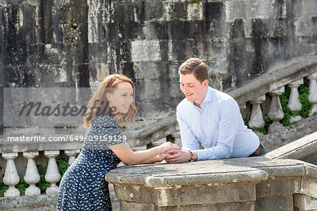 Young couple relaxing by San Miniato al Monte Church, Florence, Toscana, Italy