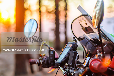 Windshield and controls of touring motorcycle at sunset, close up, Yosemite National Park, California, USA