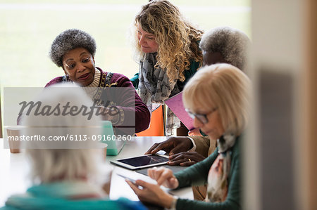 Senior business people talking in conference room meeting