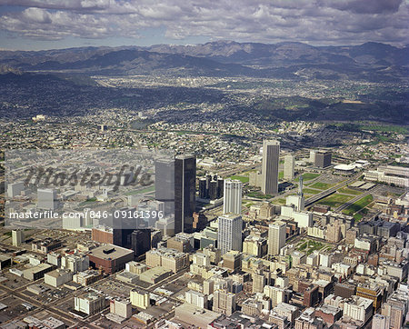 1970s AERIAL VIEW DOWNTOWN SKYLINE LOS ANGELES CALIFORNIA USA