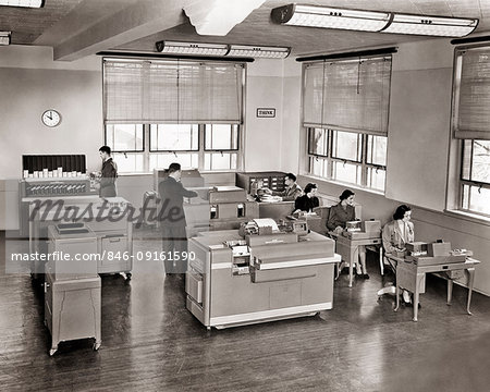 1950s THINK SIGN ON WALL IBM OFFICE INTERIOR MEN WOMEN WORKING EARLY DATA PROCESSING INSTALLATION INFORMATION SYSTEM TECHNOLOGY