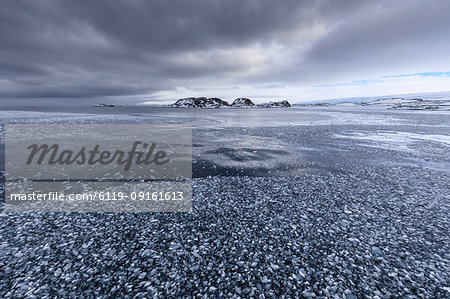 Brash ice and grease ice, strip of blue sky, Torgersen Island, glaciers of Anvers Island, Antarctic Peninsula, Antarctica, Polar Regions