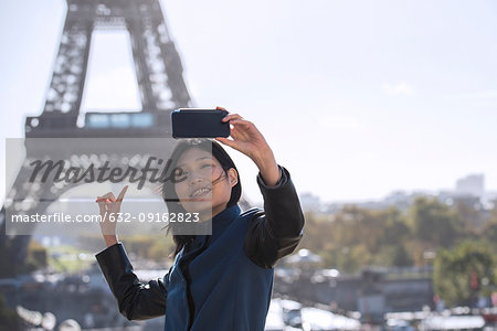 Woman taking selfie with smart phone
