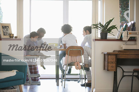 Family coloring at dining table