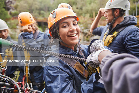 Portrait smiling woman zip lining