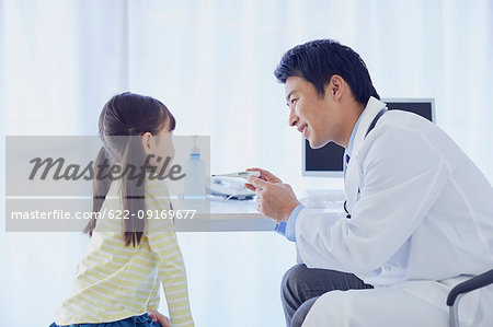 Japanese doctor with a patient in his studio