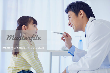 Japanese doctor with a patient in his studio