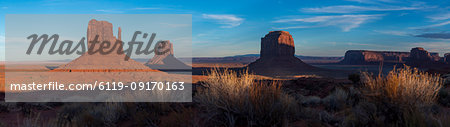 A panoramic image of the giant sandstone buttes at sunset in Monument Valley Navajo Tribal Park, Arizona, United States of America, North America