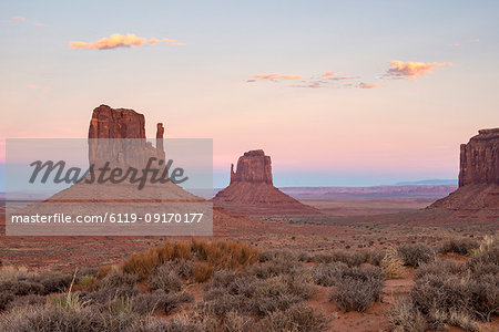 The giant sandstone buttes glowing pink at sunset in Monument Valley Navajo Tribal Park, Arizona, United States of America, North America The giant sandstone buttes glowing pink at sunset in Monument Valley Navajo Tribal Park, Arizona, United States of America, North America
