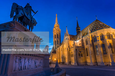 Statue of King Stephen I and Matthias Church at dusk, Fishermans Bastion, Budapest, Hungary, Europe