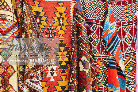 Colourful rugs and carpets for sale in Al Fahidi Historic Neighbourhood, Bur Dubai, Dubai, United Arab Emirates, Middle East