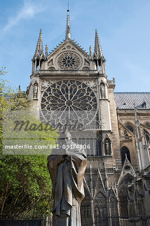 A statue of St. John Paul next to Notre-Dame Cathedral on the Ile de la Cite. Paris, France, Europe