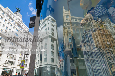 View of Buildings reflecting in designer shop window on Gran Via, Madrid, Spain, Europe