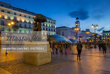 View of Bear and Strawberry Tree statue and Puerta Del Sol at dusk, Madrid, Spain, Europe