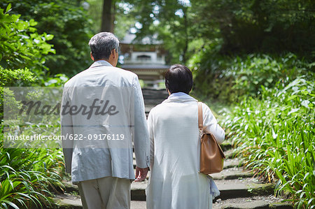 Japanese senior couple having fun at traditional inn