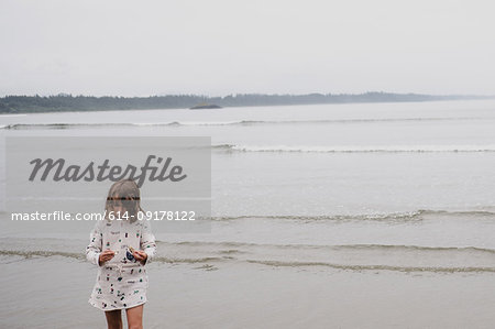 Girl on beach, Tofino, Canada