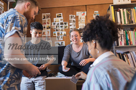 Creative business people playing cards in office