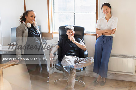 Portrait confident creative business people in office