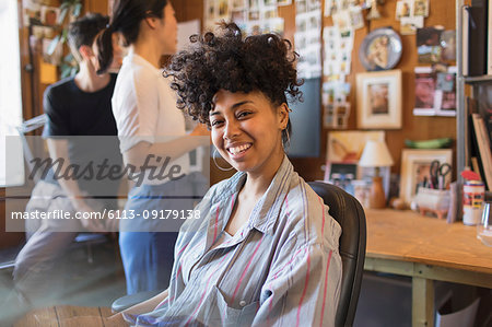 Portrait smiling, confident creative businesswoman in office