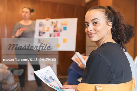 Portrait confident creative female designer in meeting