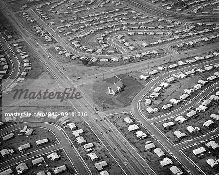 1950s AERIAL OF HOUSING DEVELOPMENT WITH CHURCH BEING BUILT ON CENTRAL INTERSECTION LEVITTOWN PENNSYLVANIA USA