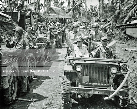 1940s GENERAL MacARTHUR RIDING IN JEEP INSPECTS WAR IN THE PACIFIC THEATER TROOPS OCTOBER 29 1944