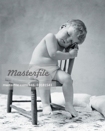 1920s 1930s TIRED BABY TODDLER WEARING COTTON CLOTH DIAPER FALLEN ASLEEP SITTING IN CHAIR 1920s 1930s TIRED BABY TODDLER WEARING COTTON CLOTH DIAPER FALLEN ASLEEP SITTING IN CHAIR