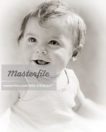 1930s PORTRAIT OF SMILING BABY GIRL  WEARING COTTON TANK TEE SHIRT CURL ON HER FOREHEAD