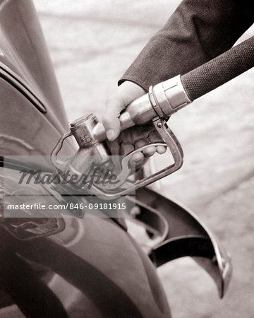 1940s MALE HAND PUMPING GASOLINE FUEL INTO CAR