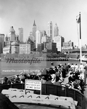1930s 1940s NEW YORK CITY DOWNTOWN SKYLINE FROM THE STATUE OF LIBERTY BOAT UPPER DECK NYC USA 1930s 1940s NEW YORK CITY DOWNTOWN SKYLINE FROM THE STATUE OF LIBERTY BOAT UPPER DECK NYC USA