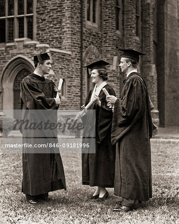 1930s 1940s GROUP COLLEGE GRADUATES ONE WOMAN TWO MEN WEARING MORTARBOARD CAPS HATS AND GOWNS HOLDING DIPLOMAS TALKING TOGETHER