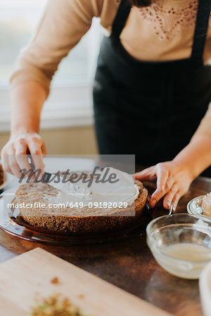 Woman in apron baking vegetarian cake