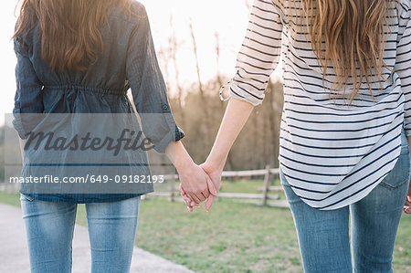 Girlfriends taking walk in park