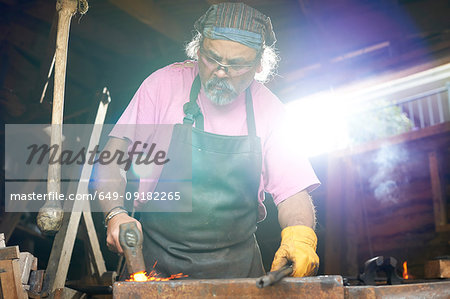 Blacksmith working in his forge