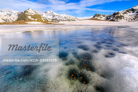 Ice melting at Lake Andossi during spring thaw, Chiavenna Valley, Spluga Valley, Sondrio province, Valtellina, Lombardy, Italy, Europe