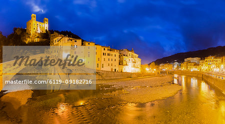 Lights reflected in the river during twilight, Dolceacqua, Province of Imperia, Liguria, Italy, Europe