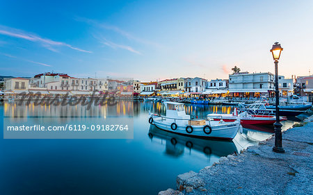 Old Venetian harbour, taverns on seaside at dusk, Rethymno (Rethymnon), Crete, Greek Islands, Greece, Europe