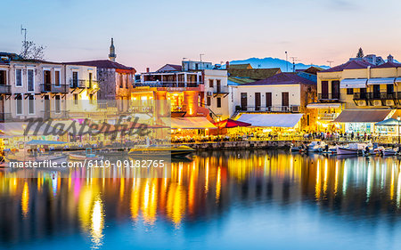 Old Venetian harbour, taverns on seaside at dusk, Rethymno (Rethymnon), Crete, Greek Islands, Greece, Europe
