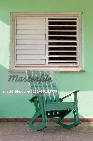 Green rocking chair on veranda, UNESCO World Heritage Site, Vinales, Pinar del Rio, Cuba, West Indies, Caribbean, Central America