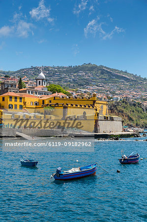 View of fishing boats in harbour and St. James Fort, Funchal, Madeira, Portugal, Atlantic, Europe