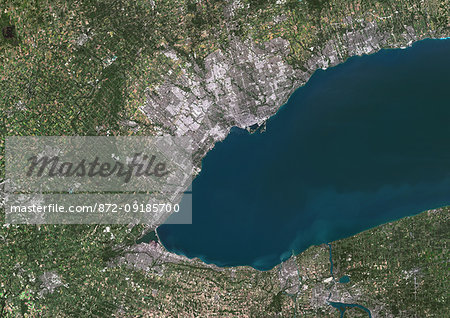 Color satellite image of Toronto, Hamilton and Niagara Falls, Canada. Toronto lies on the northern shore of Lake Ontario, while Hamilton is at the west end of the lake. Niagara Falls are on the Niagara River at south, that forms part of the border between the province of Ontario in Canada (on the west) and the state of New York in the United States (on the east). Image collected on September 04, 2016 by Sentinel-2 satellites.