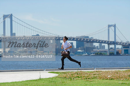 Japanese man running downtown Tokyo