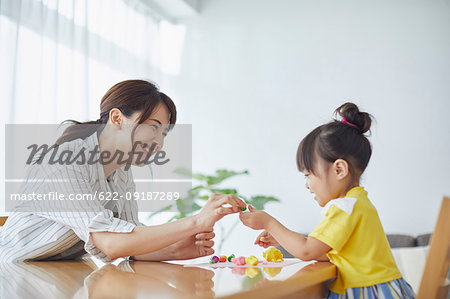 Japanese mother and kid playing