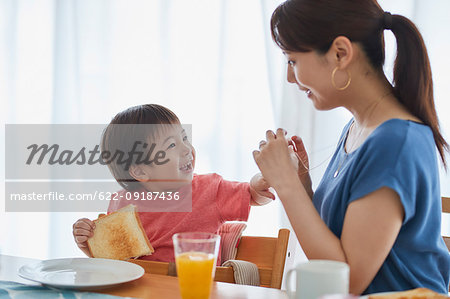 Japanese mother and kid having breakfast