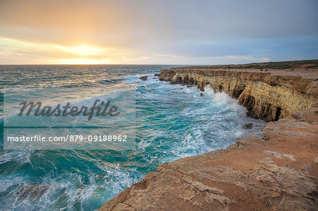 Cyprus, Ayia Napa, The sea caves at Cape Greco at sunset after a storm