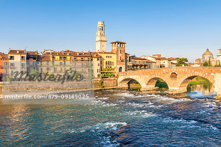 Ponte Pietra (Stone Bridge) and Verona old town at sunrise. Verona, Veneto, Italy